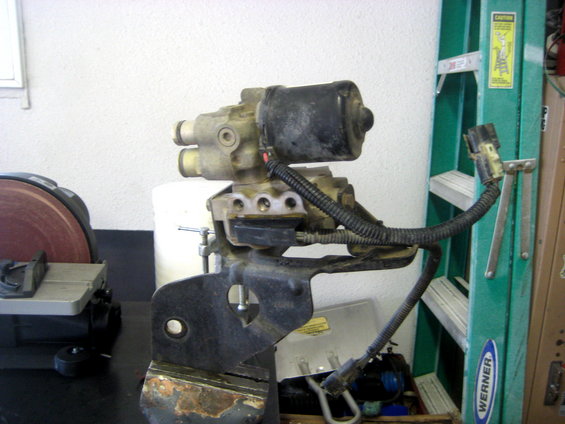 ABS actuator assembly with black motor and wiring harness