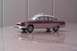 1991 Ford Crown Victoria - A model taxi with a maroon and white paint scheme sits on a reflective surface.