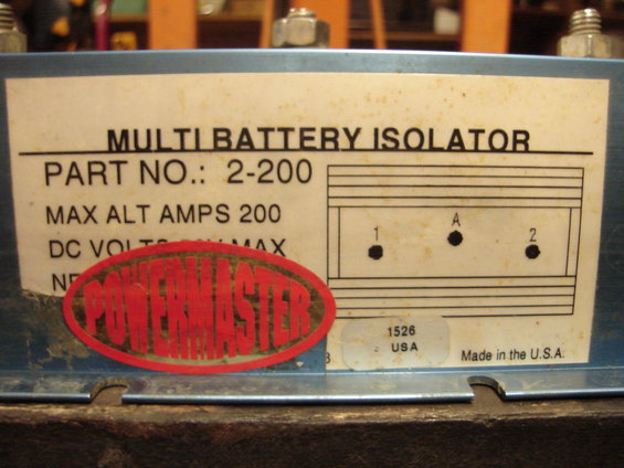 Blue metal isolator with a white label showing 'Multi Battery Isolator', 'Part No.: 2-200', and 'Powermaster' logo