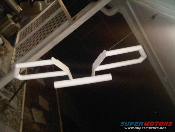 White PVC pipe structure with two angled white pieces attached