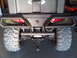 2004 Harley-Davidson Fat Boy - Rear view of an ATV showing its heavy-duty bumper, large tires, and the Polaris brand emblem.