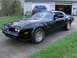 1978 Pontiac Trans Am - This 1978 Pontiac Trans Am features a black exterior with gold trim and a distinctive hood decal.
