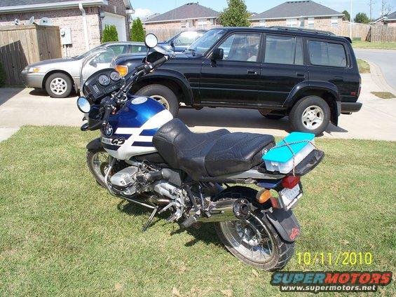 2001 BMW R1150GS ABS motorcycle parked on grass, with a black SUV and silver sedan behind it