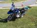 2001 BMW R1150GS ABS - A blue BMW R1150GS motorcycle is parked on a grassy lawn in front of a suburban house.