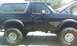 1994 Ford Bronco - This 1994 Ford Bronco features a lifted suspension and aggressive off-road tires, ready for adventure.