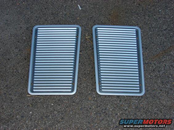 two silver grilles with horizontal slats