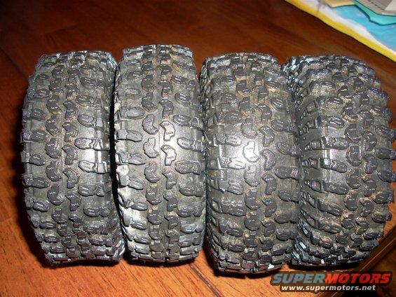 four chunky off-road tires lined up