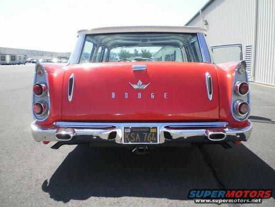 Red 1959 Dodge station wagon rear view with chrome bumper and dual exhaust pipes