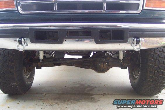 Front bumper, tow hooks, and front axle of a truck