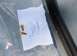 1976 Ford Ranchero - A document with part numbers and dates, along with two plastic fasteners, is visible in the image.
