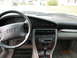 1995 Audi A6 - Dashboard and interior of a 1995 Audi A6, wood trim and the iconic four rings on the steering wheel.