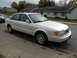 1995 Audi A6 - A white sedan is parked on the side of a residential street.