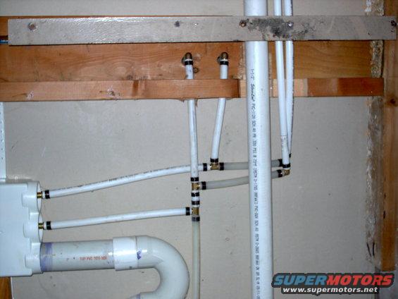 Plumbing pipes and wooden beams