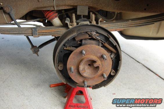 Rear drum brake assembly on a 1994 Ford Bronco, showing rust and wear