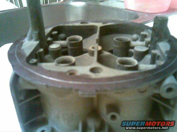 Carburetor top view, showing four intake ports and internal mechanisms