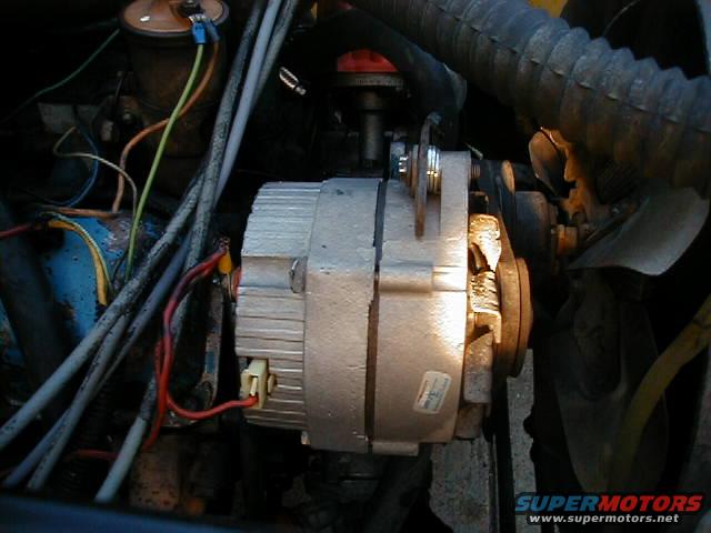the previous owner moved the alternator up top instead of down low where it was succeptible to mud and water but he didnt align it so i got some washers and did that.  Real easy job