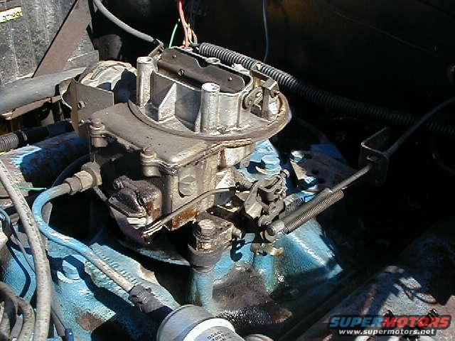 old carb on the jeep....POS.  Replaced with a new motorcraft that was rebuilt by holley.  Dont have a good pic of the new one yet
