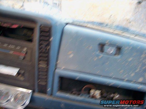 1987 Ford F-250 dashboard showing radio and glove box