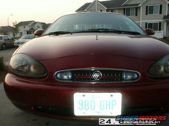 Front view of a red 1998 Mercury Sable with Iowa plates