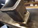 1989 Ford Bronco - Close-up view of a welded metal hitch receiver, indicating a custom or aftermarket part.