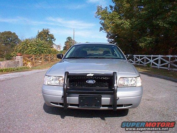 Silver 2004 Ford Crown Victoria, front view, with black push bar and grille