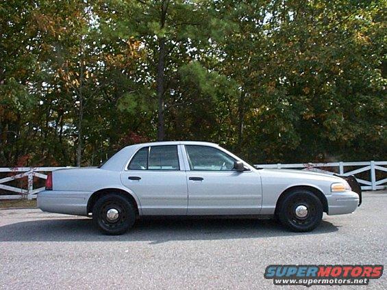 Silver 2004 Ford Crown Victoria police sedan, side view