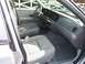 2004 Ford Crown Victoria - Interior view of a 2004 Ford Crown Victoria, highlighting the front seating area and dashboard controls.