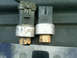 1996 Ford Bronco - Two automotive pressure sensors are shown side-by-side, with visible wear and tear.