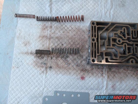 Transmission valve body with four springs laid out on a paper towel