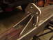 1989 Ford Bronco - Close-up of a custom fabricated metal bracket, likely for off-road modification, welded onto a vehicle's frame rail.