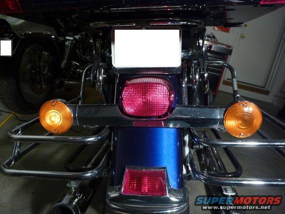 Blue motorcycle rear with chrome luggage racks and saddlebags. 2007 Harley-Davidson Electra Glide Clsc
