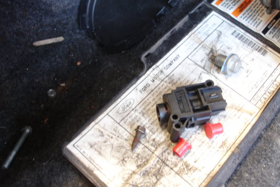 Ford Motor Company label with sensor and bolts
