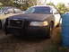 2003 Ford Crown Victoria - Front view of a 2003 Ford Crown Victoria police interceptor with a push bar.