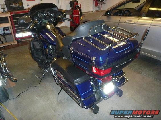 2007 Harley-Davidson Electra Glide Clsc parked in a garage next to a car