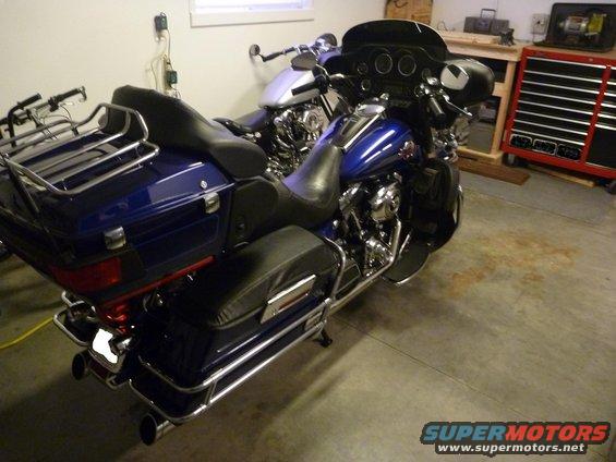 Blue Harley-Davidson Electra Glide Clsc parked in garage next to another motorcycle