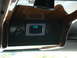 1992 Ford C-350 (Centurion Conversions) - A digital gauge displays '128' within the interior of a vehicle, surrounded by wood trim.