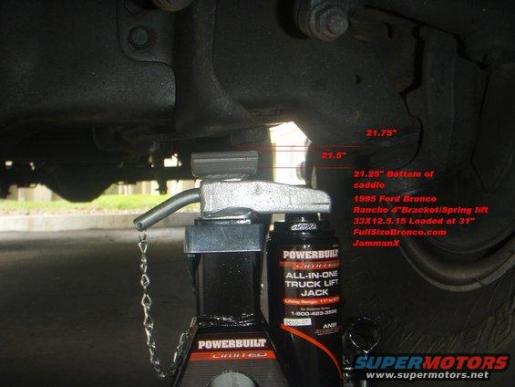 1995 Ford Bronco undercarriage with a Powerbuilt truck jack supporting it