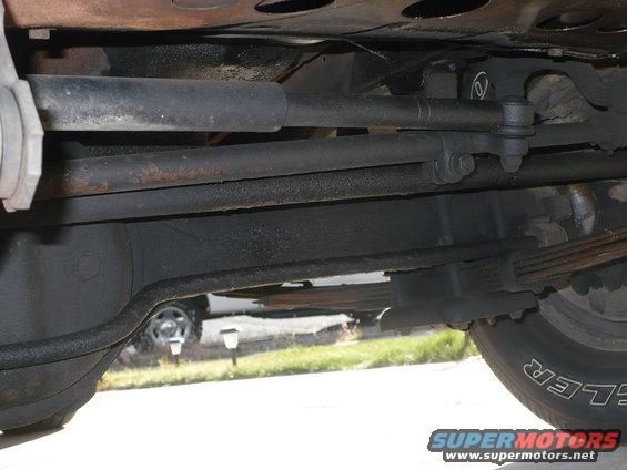 Undercarriage view showing steering linkage and leaf springs