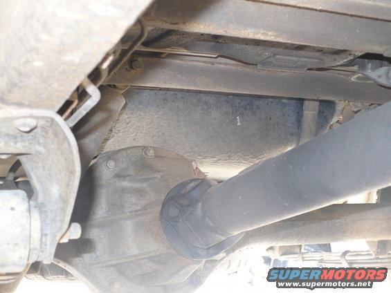 Underside view of vehicle driveshaft and differential with a visible number '1'