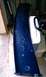 1999 Ford Mustang - This blue car spoiler shows significant paint damage and water spots, indicating it is a used part.