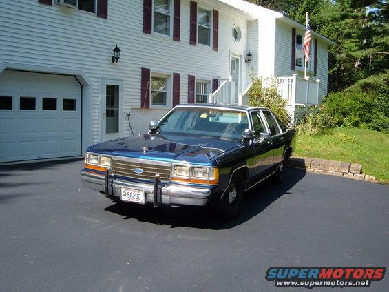 Dark blue 1990 Ford Crown Victoria parked in driveway, front quarter view