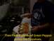 1989 Ford Bronco - A person is assembling a sandwich with various ingredients in a food service establishment.