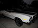 1973 Ford Ranchero - A white 1973 Ford Ranchero with a black hood stripe is shown from a three-quarter front angle at dusk.