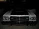 1973 Ford Ranchero - Front view of a white 1973 Ford Ranchero with a black hood and chrome accents.