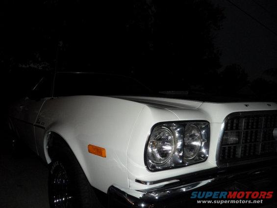 White 1973 Ford Ranchero front quarter view with chrome grille and dual headlights