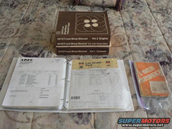 Stack of 1978 Truck Shop Manuals and open binders with receipts