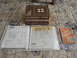 1978 Ford Bronco - Shop manuals and receipts related to a 1978 Ford Bronco are laid out on a patterned surface.