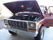 1978 Ford Bronco - Front view of a 1978 Ford F-150 pickup truck, hood open, revealing the engine compartment.