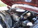 1978 Ford Bronco - Close-up view of the engine compartment, highlighting the V8 engine and associated components.