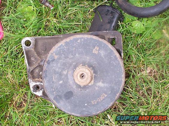 saginaw-004.jpg Stock Pump with it's bracket. bolt holes are 3-3/8" apart. 